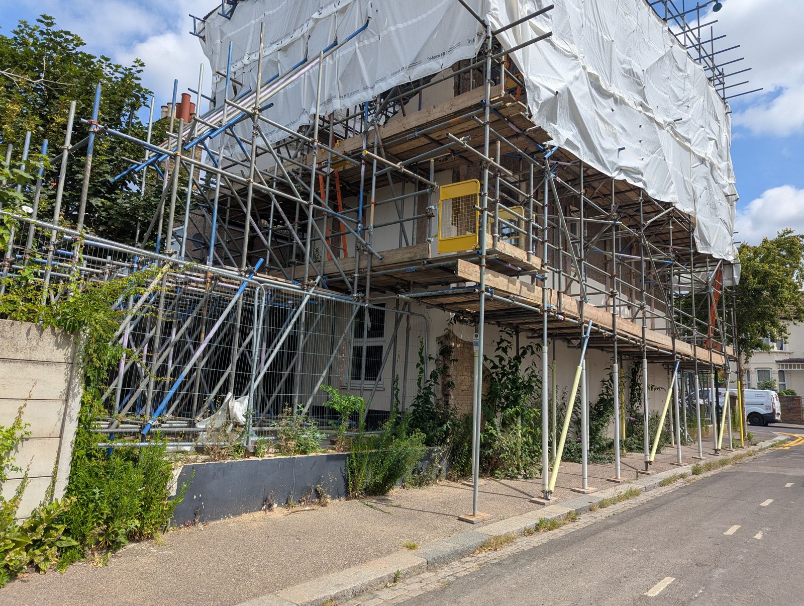Scaffolded terrace at Grange Road during fire reinstatement works